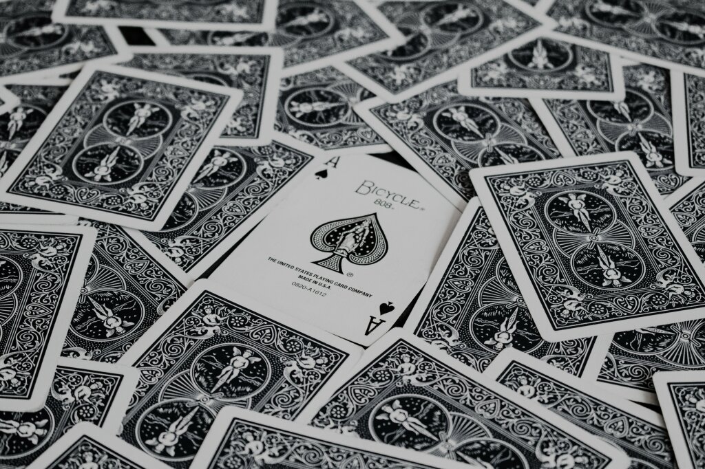 A set of playing cards with the ace card face up.